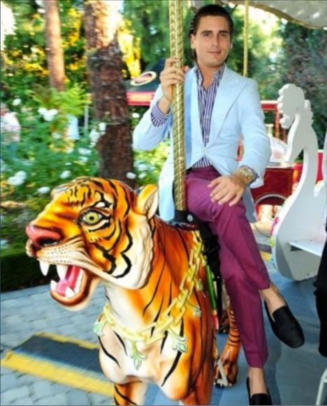 Lord Scott Disick, pictured mounting his regal Bengal tiger, adorned with the Disick-Kardashian