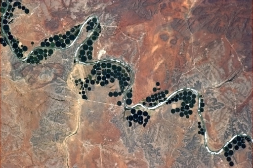 colchrishadfield:Where there’s water, there’s life. Serpentine river and center pivot irrigation far