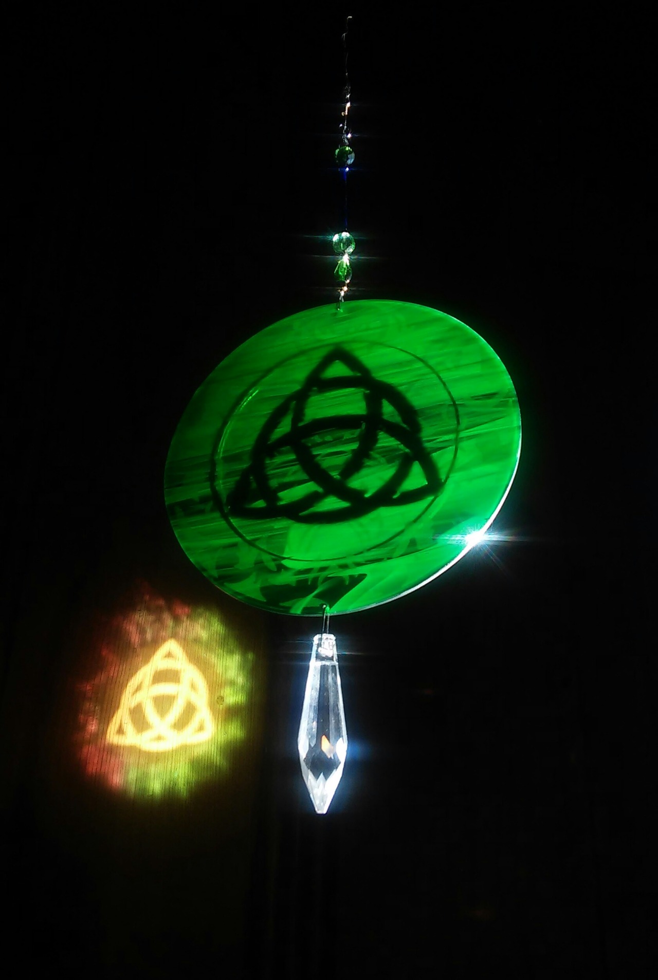 ornamentalglass:  Triquetra Rainbowlightcaster with Green Man on reverse side.  My