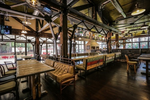 steampunktendencies:    At the CRAZY BBQ’s entrance visitors are greeted by an Austrian steam engine dated by 1900, which now serves as a barbecue.      Surrounded by a pine forest, the complex includes the main restaurant building, the Club House Crazy