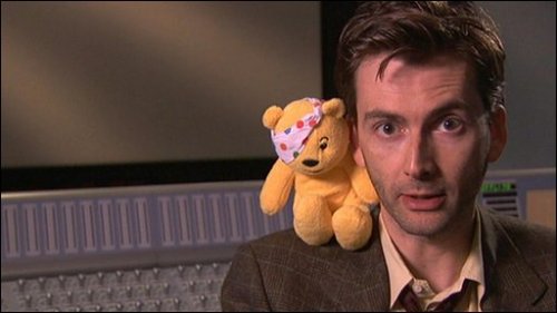 tennydr10confidential: David Tennant being adorkably playful posing with toys.