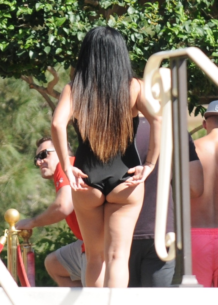 At first I thought she was going to pull her suit out of her crack, but she never