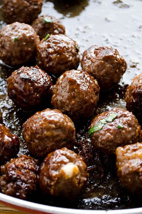 cheese stuffed meatballs coated with honey and pomegranate molasses.