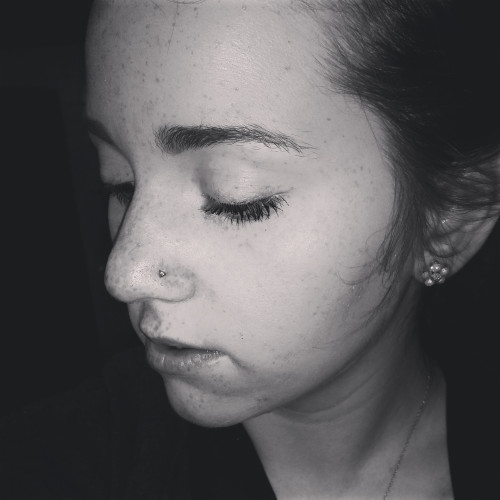 Black and white and a nose piercing.