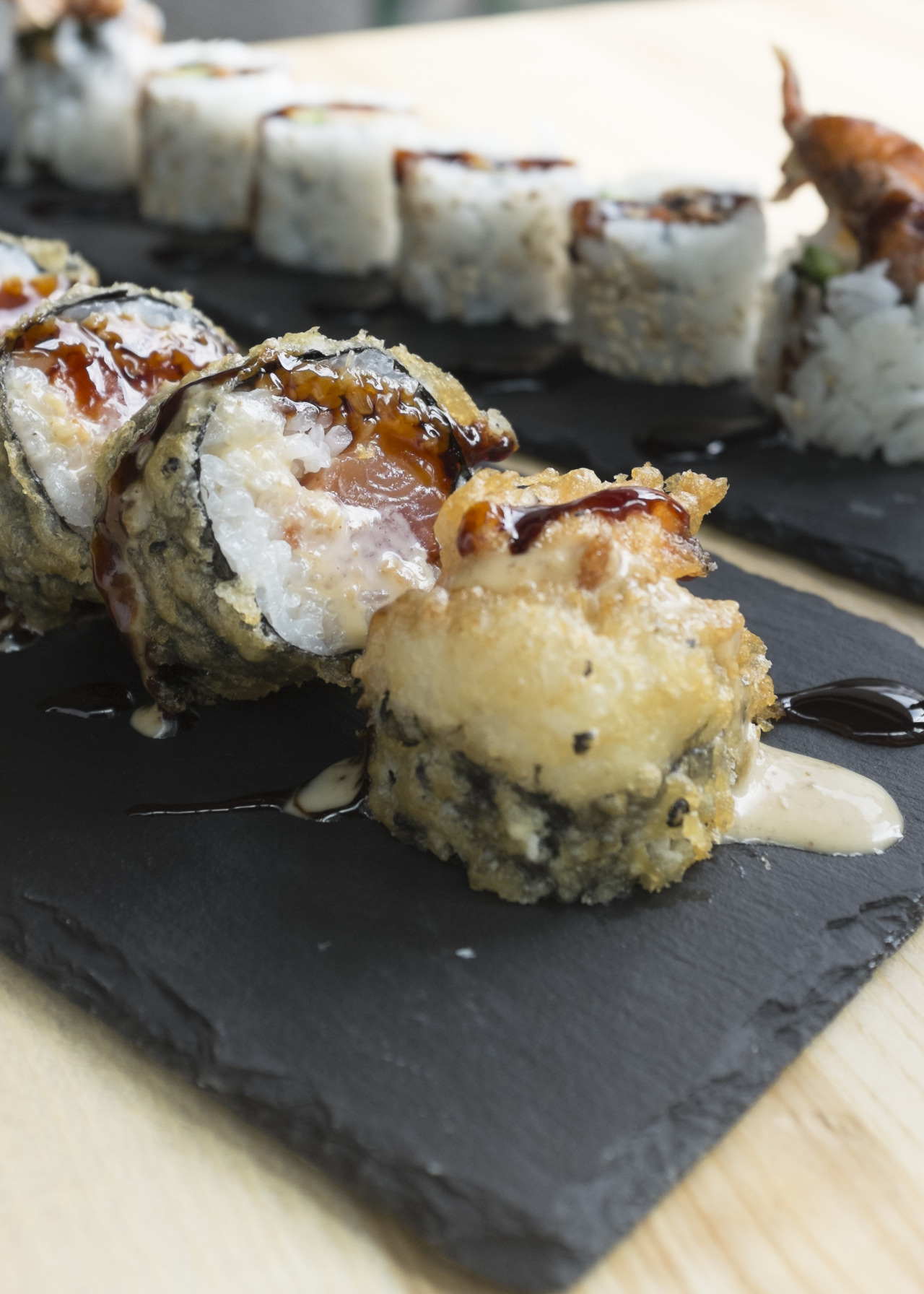 Cecile Vadas — Tempura seafood sushi filled with fresh salmon and...