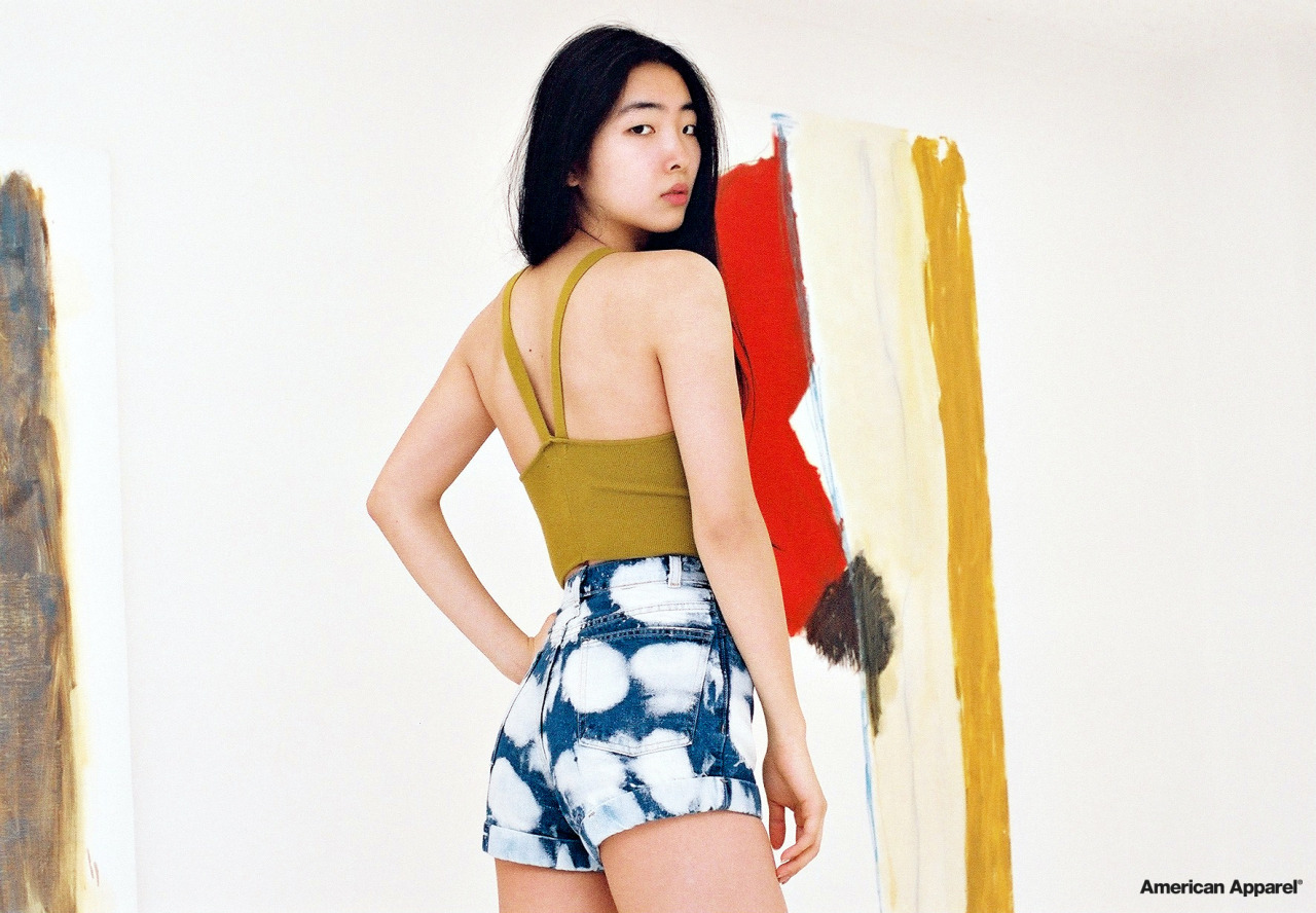 americanapparel:  Yuri wears the V Strap Tank &amp; Dark Wash Indigo Clouds Denim