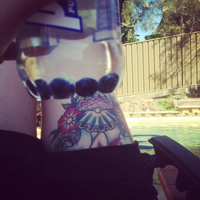 Poolside with some blueberry water 👌☀️