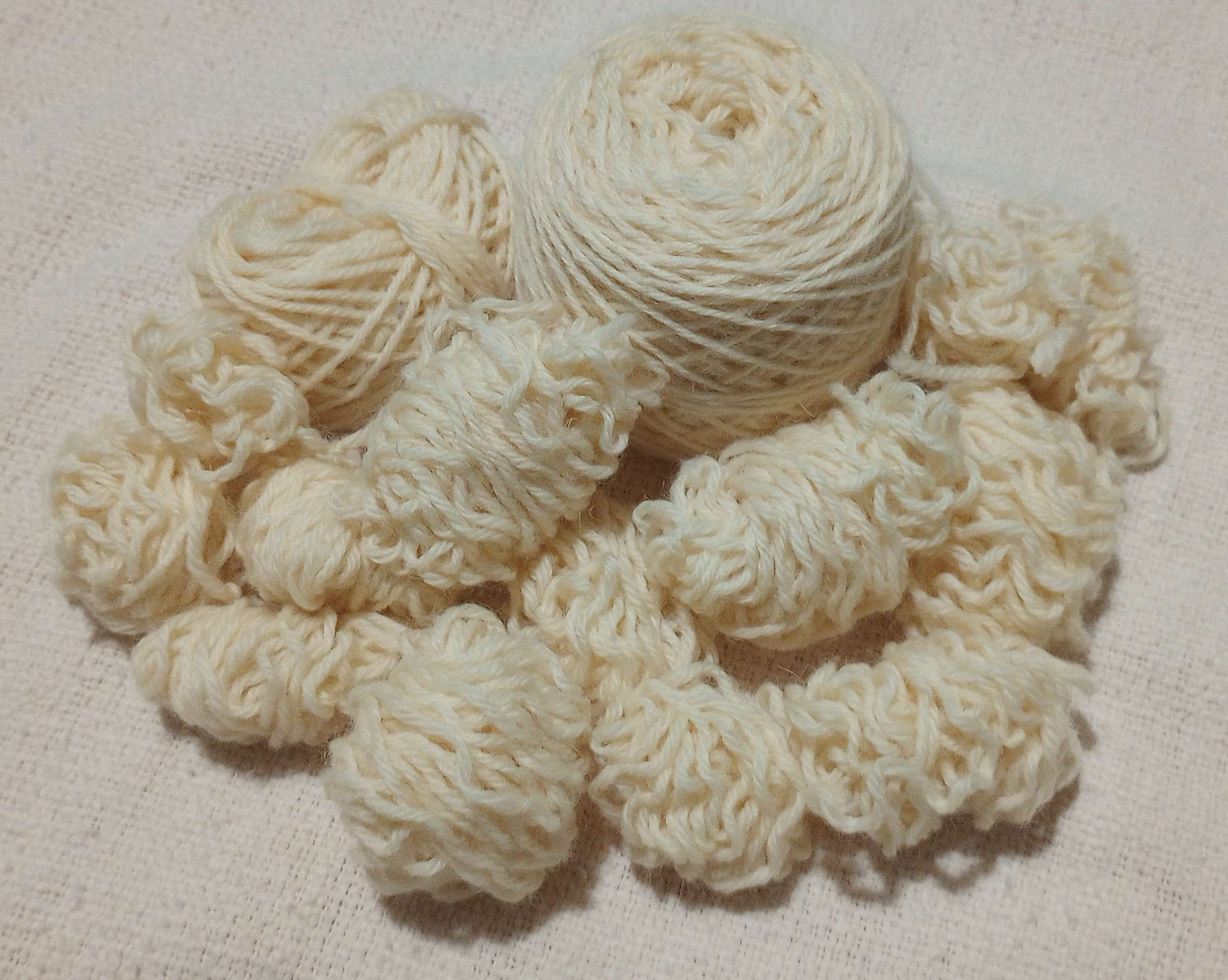 pile of frogged aran yarn