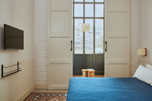 {Brooklyn-based design firm Studio Tack designed this hotel in Barcelona. The vibe is energetic and 