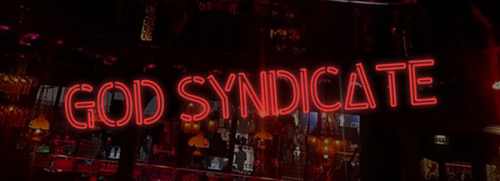Image with the words "God Syndicate" in neon lights with the scene of a bar behind it