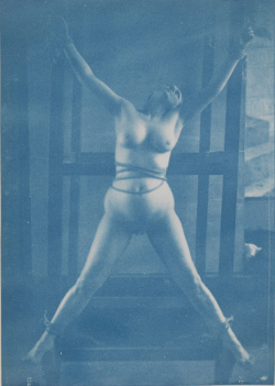 howsaucy: Charles-François Jeandel, Femme nue de face attachée en croix de Saint-André, bandage autour du ventre, p.4, verso of Jeandel’s photography album. 1890-1900, cyanotype, 17 x 12 cm, Musée d'Orsay, Paris 