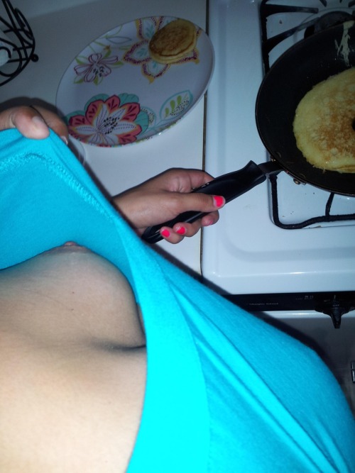 smoothballsrolling:  in the kitchen, both hands busy frying some pancakes, she was in no position to act fast and he caught a good look deep down her blouse. Then again, where is the harm in it?