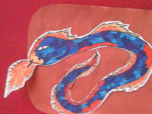 The firs pic is a dragon I drew about a year ago.The second drawing is the same dragon being re-draw