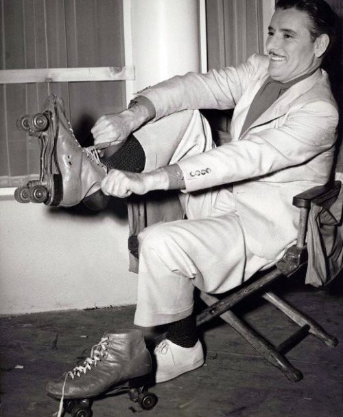 matineemoustache: Ronald Colman putting on roller skates. (1941)