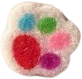 fuzzy sticker of a dog's paw print with colorful toe prints.