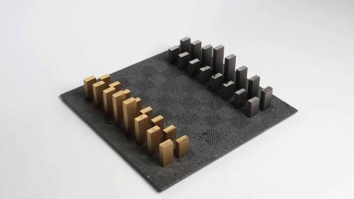 Tarek Elkassouf‘s chess setMaterial: Carrara marble board with Brushed Stainless Steel and Gun Metal