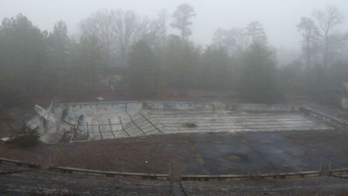 destroyed-and-abandoned:   Foggy day at abandoned Olympic-size swimming pool in rural South Carolina   Album in comments by Dyanthis Read More
