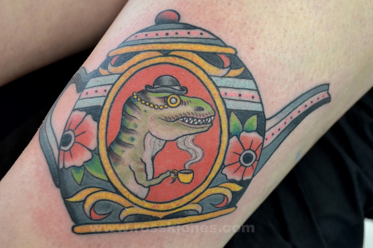 Psychedelic TRex tattoo on the left thigh
