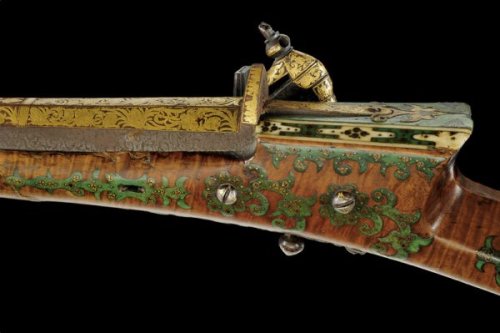 A brass and gold decorated, green painted miquelet musket originating from Turkey, 19th century.