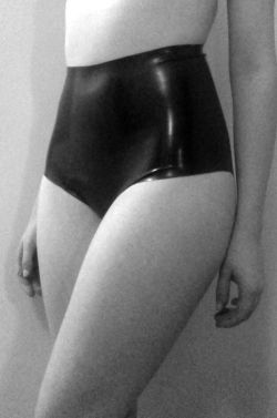 goth-nymphet:  nonameimdead:  simple black latex hotpants on We Heart It.  ☩ 