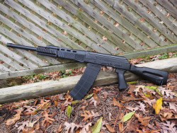 gunrunnerhell:  SGL12-09 A Saiga 12 shotgun that is actually imported and sold in this configuration. Earlier Saiga models were brought into the U.S in a neutered form that resembled a sportsman’s rifle more than it’s AK heritage. The handguard and