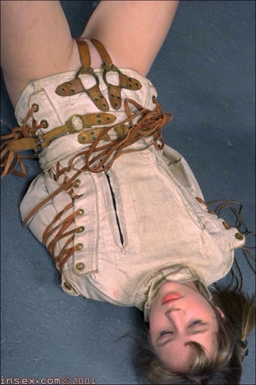 bridle-and-bit:  fuckiamsexedout:  Girl in straitjacket  An older and more kinky looking model. Take a good look at the twin crotch-straps. mmmmm!