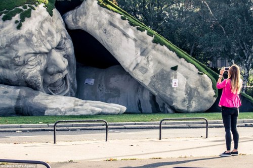 sixpenceee:  Hungarian artist Ervin Herve-Loranth is responsible the enormous sculpture, entitled ‘Feltépve’ which translates as ‘ripped up’ or ‘pop up’. The gigantic man appears to be emerging from underneath a blanket of grass. It was