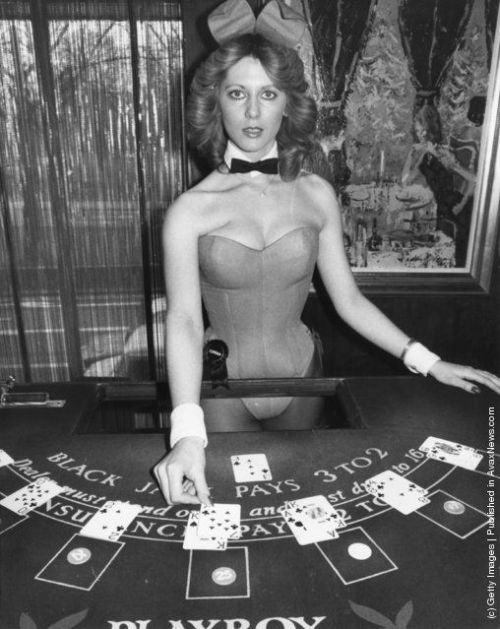 Croupier and bunny girl, Corrina, dealing cards at the Hefner-Playboy Park Lane club in London. (Pho