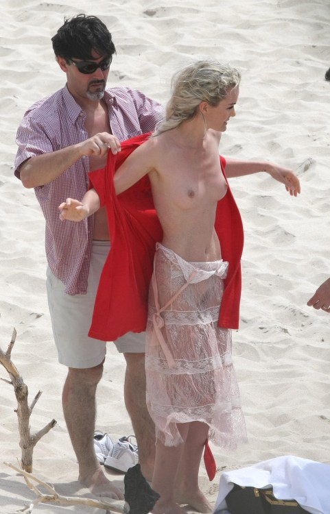 toplessbeachcelebs:  Laeticia Hallyday (Model) nude for a photoshoot on the beach (March 2009) 