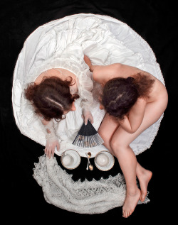 bea789: killerbeesting: Serge N. Kozintsev, Morning Tea  I know this is meant to be a skull but two ladies drinking some tasty tea with one naked and sitting basically on top of the other who is wearing a pretty dress is definitely some lesbian art right