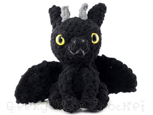 Black dragon with yellow sparkly glow-in-the-dark eyesJust one available here: https://www.etsy.com/