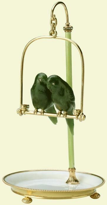 A pair of budgerigars on a perch, by Fabergé. The birds carved in nephrite with rose diamond eyes, t