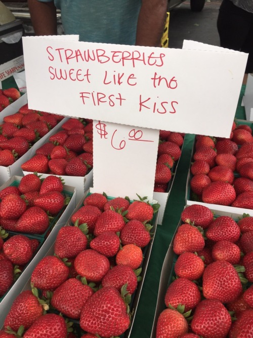 britomart:[ID: a photograph showing rows of punnets of strawberries for sale. there is a white cardb