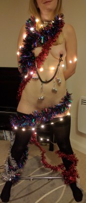 corinthiansjottr:  Belle last night before I did bad electro-play things to her at a sparks party.   Her bells jingled. And who knew electric tinsel could be so much fun!   (feeling festive with @lost-girl-23)