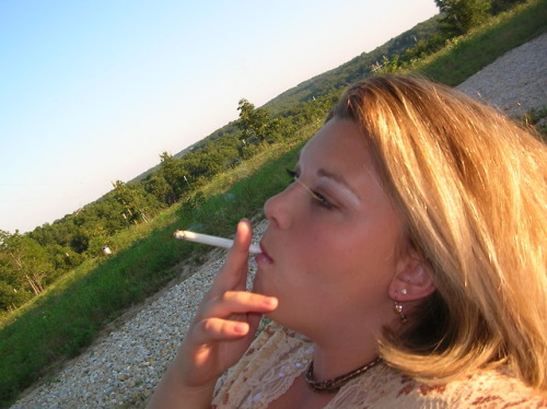 captkmnus: Nikki (1 of 2) Love her smoking style she needs a cock to suck on