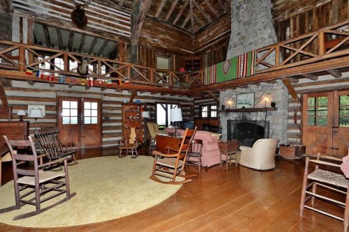 Unique mountain lodge, circa 1935 features massive 2 story great room w/2 stone fireplaces, screened