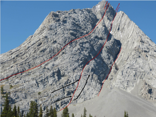 rockon-ro:  This is some fantastic geology in the Rocky Mountains of Alberta, Canada. The high angled thrust faults, that built the Rocky’s height, can be seen on this mountain. Interpretation of a few thrust faults are shown on the upper photo. 