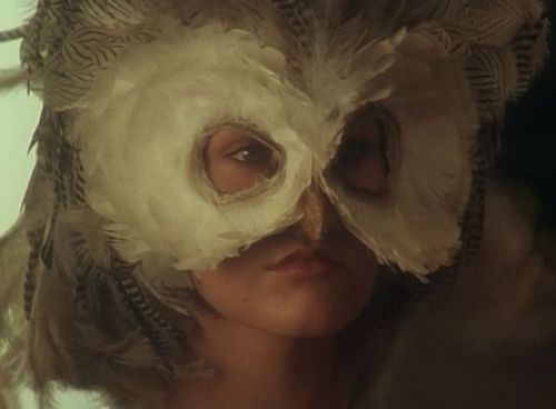 o-1968:O tried on the mask Michael had given her. In fact, it was a very similar same mask to the on