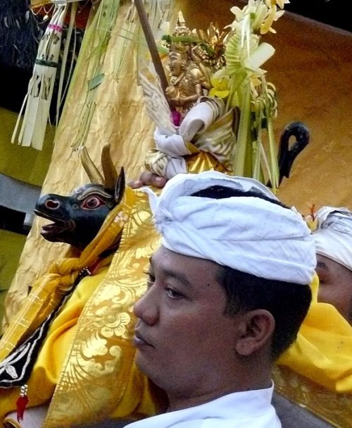 Priest carries Shiva image (pratima) in procession, Bali