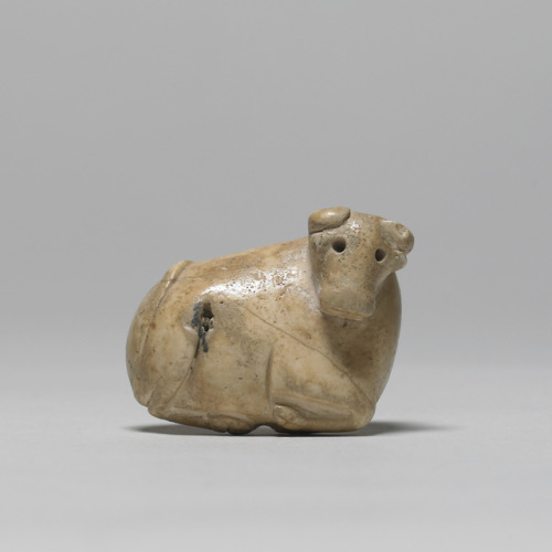 Ancient Mesopotamian stamp seal (carved marble) in the form of a reclining calf.  Artist unknown; ca