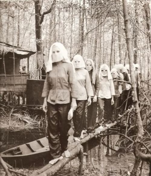  Vietcong women, wearing masks, returning after training [685x800] 1972 : HistoryPorn 