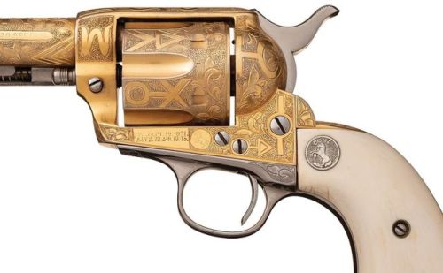 Gold plated and Cattle Brand engraved Colt Single Action Army with carved ivory grips. Manufactured 