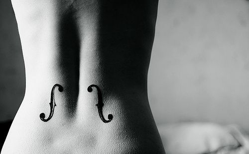 cutelittletattoos:  Little lower back tattoo of two f holes.