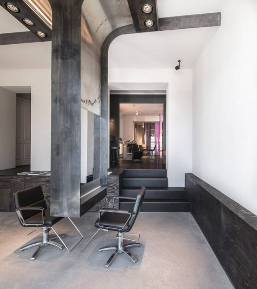 {Even more masculine, minimal, and modern. This modern industrial salon by Berlin base Karhard Archi