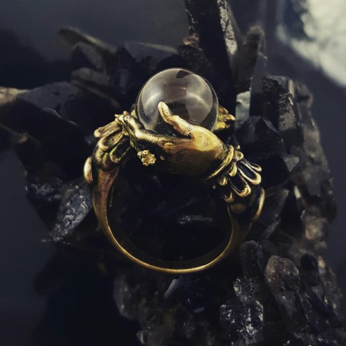 omniastudios: The Oracle. Antiqued brass with quartz orb. Hand wears a tiny white topaz ring.Our jew