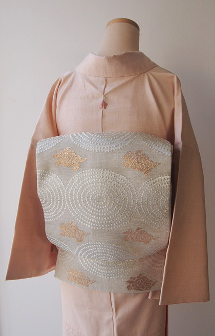 Soft cherry blossom colored kimono, with refined open weave embroidery, paired with silvery ripples 
