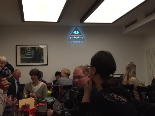 trydain:  gurkencupcake:  I had to do a Christmas presentation and I have a picture of Bill for my desktop picture.   Now it looks like I summoned Bill Cipher at our Christmas party and he’s watching everyone, waiting for the perfect time to strike