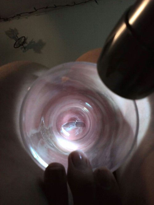 sexkitten312:  Using a flashlight. Got the glass way further in this time.  Always be careful with glass - personally I avoid it since it can break, however, that is a spectacular resulting gape. Sometimes a hard unyeilding toy has it’s uses. 