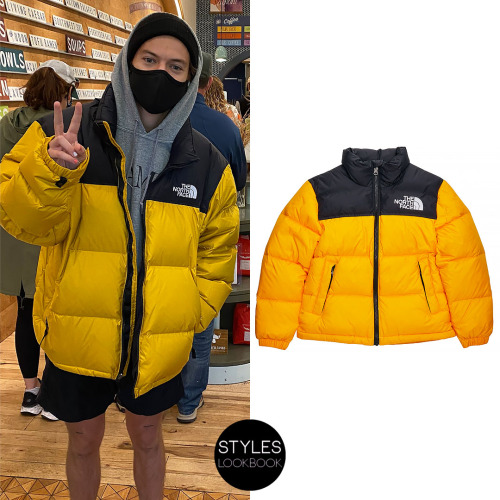 Out in Boston, Harry was pictured wearing the North Face 1996 Retro Nuptse Jacket in black and yello