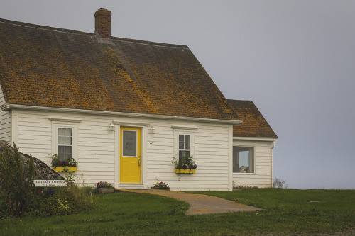 Cottage with a yellow door in Nova Scotia.